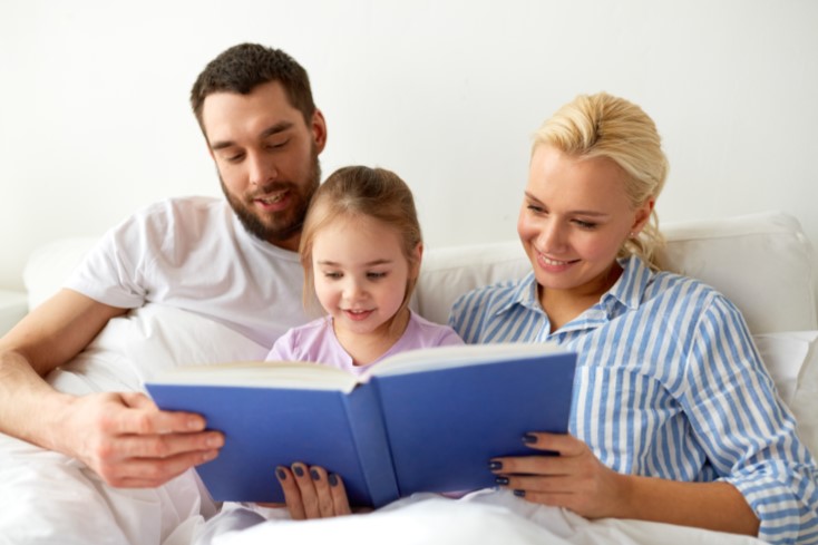 Parent Reading Book to Child